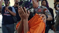AA dijerat polisi dengan Pasal 29 jo Pasal 4 Ayat 1 huruf D dan atau Pasal 35 jo Pasal 9 UU Nomor 44 Tahun 2008 tentang Pornografi dengan ancaman hukuman paling lama 12 tahun penjara.