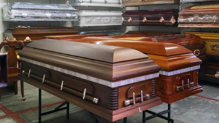Assortment of coffins displayed in a coffin store in Oaxaca Mexico.