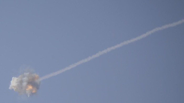 An Israeli Iron Dome air defense system missile is seen intercepting rockets fired from Gaza over Sderot, southern Israel, Wednesday, Nov. 13, 2019. (AP Photo/Ariel Schalit)