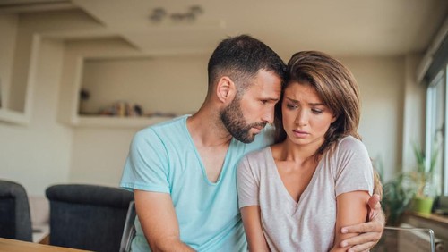 Upset couple ignoring each other at kitchen, relationship difficulties, quarrel