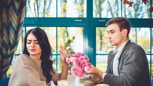 Upset couple ignoring each other at kitchen, relationship difficulties, quarrel