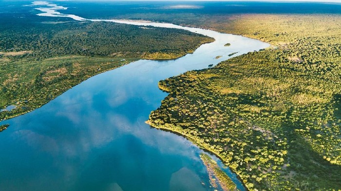 Canoeing down the Zambezi River in Zimbabwes Mana Pools.