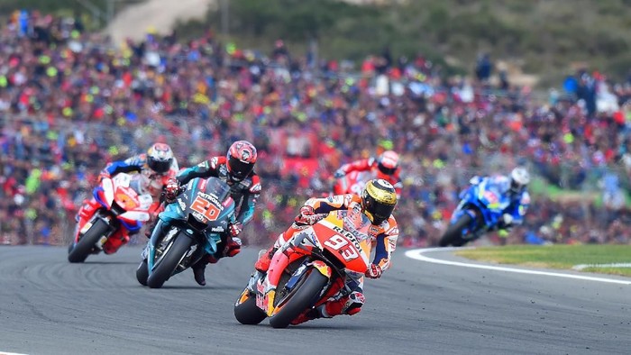Repsol Honda Teams Spanish rider Marc Marquez rides ahead Petronas Yamaha SRTs French rider Fabio Quartararo during the MotoGP race of the MotoGP Valencia Grand Prix at the Ricardo Tormo racetrack in Cheste near Valencia, on November 17, 2019. (Photo by JOSE JORDAN / AFP)