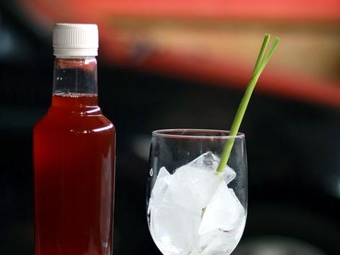 Bir Pletok, the traditional non-alcoholic beer from Betawi culture, Jakarta. The beer, that is basically a herbal concoction, is served with foam on top after being shaken with ice cubes. The beer is served in a old-fashioned glass filled with ice cubes and garnished with lemongrass and pandan leaf.