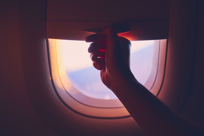 travel to Paris, view of Eiffel Tower from the window of airplane, holidays in France, Europe