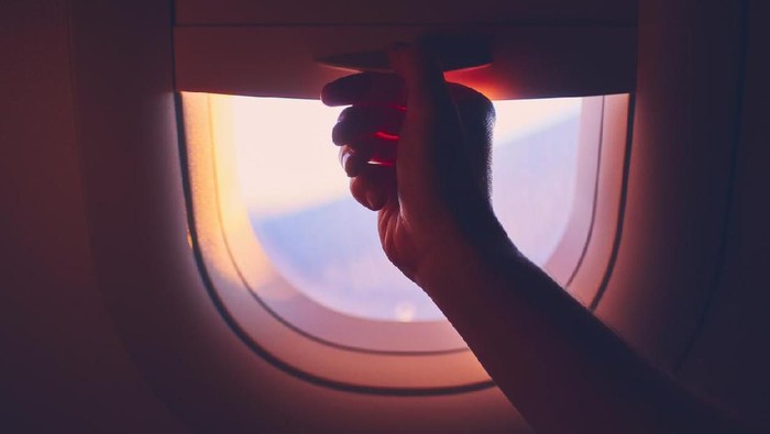 travel to Paris, view of Eiffel Tower from the window of airplane, holidays in France, Europe