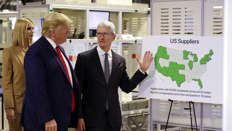 President Donald Trump tours an Apple manufacturing plant, Wednesday, Nov. 20, 2019, in Austin with Apple CEO Tim Cook, Ivanka Trump, the daughter and adviser of President Donald Trump and others. (AP Photo/ Evan Vucci)