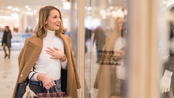 Three women shopping together in a clothing store in Japan