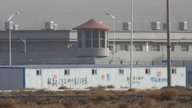 FILE - In this Monday, Dec. 3, 2018 file photo, a watchtower and barbed wire fences are seen around a facility at the Kunshan Industrial Park in Artux, in China's western Xinjiang region.  This is one of a growing number of internment camps in the Xinjiang region, where, according to some estimates, 1 million Muslims are detained, forced to abandon their language and religion and subjected to political indoctrination.  Highly confidential blueprint documents leaked to a consortium of news organizations expose the Chinese government's deliberate strategy of locking up ethnic minorities to reconfigure their thoughts and even the language they speak (Photo / AP File).