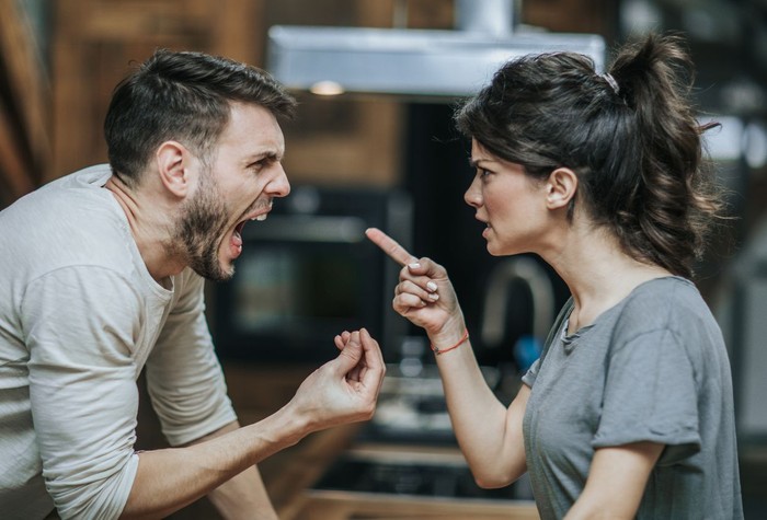 zodiak Upset indian female worker sitting at desk in office looking at pc screen feels unhappy and shocked. Millennial hindu woman reading unpleasant notification having system fault and big troubles concept