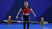 Dalam pertandingan ini Lisa membukukan total angkatan 169 kg.