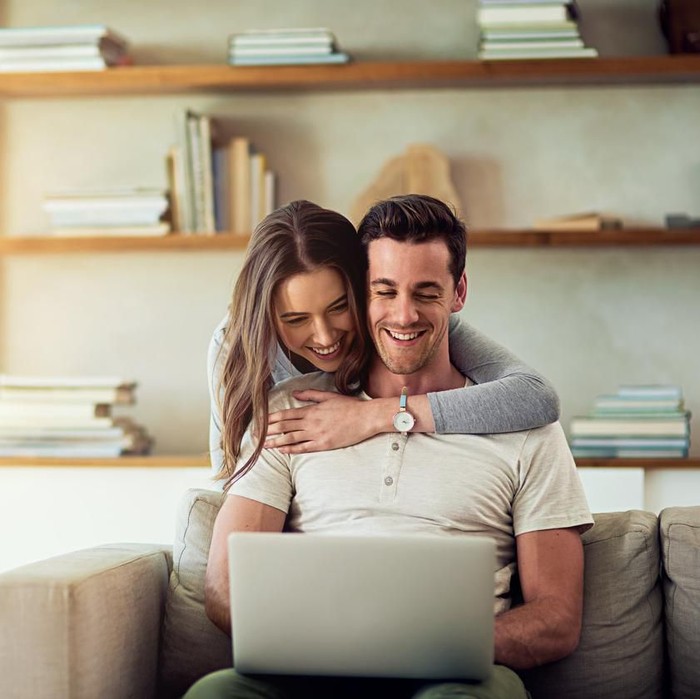 Head shot woman anxious worried woman sitting on couch at home. Frustrated confused female feels unhappy, problems in personal life, quarrel break up with boyfriend and unexpected pregnancy concept