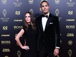 Saya mencintai pekerjaan saya, tapi saya harus meninggalkannya demi mengikuti kekasih saya kemanapun sepakbola membawanya, kata Rike Nooitgedagt soal keputusan meninggalkan pekerjaannya demi Van Dijk. (Anne-Christine POUJOULAT / AFP)