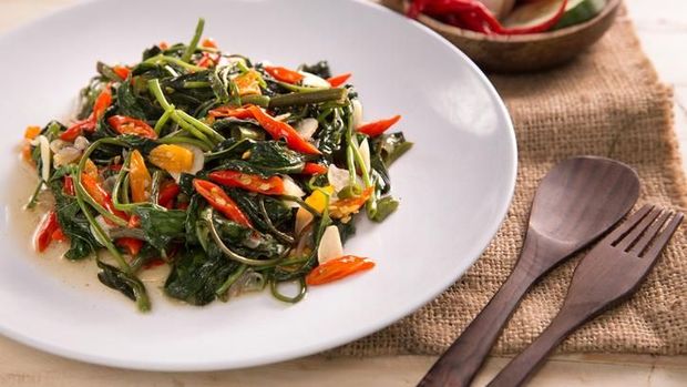 Delicious Cah Kangkung, Delicious stir fried water spinach or kale. Indonesian food