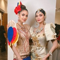 Wanita 29 tahun ini mengenakan gaun rancangan desainer Filipina, Eric Pineda. Gaun berwarna nude dengan aksen payet tersebut diberi hiasan Kiping pada bagian lengan dan hem bawah. Foto: Instagram/@meganbata