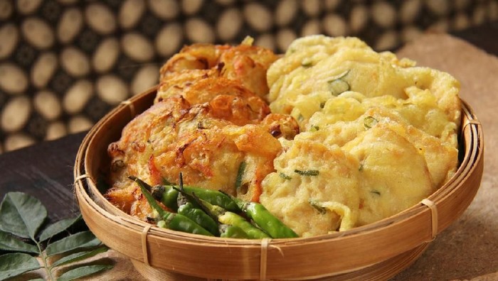 gorengan Indonesian corn fritters or Bakwan Jagung served with red chilies
