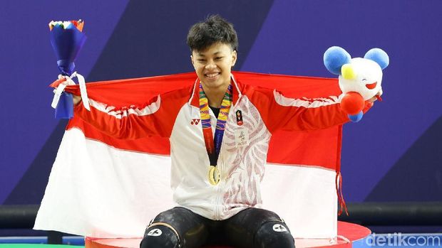 Atlet angkat besi, Rahmat Erwin Abdullah, menambah koleksi medali emas Indonesia di SEA Games 2019 Filipina. Dia menjadi yang terbaik di kelas 73 kg putra.