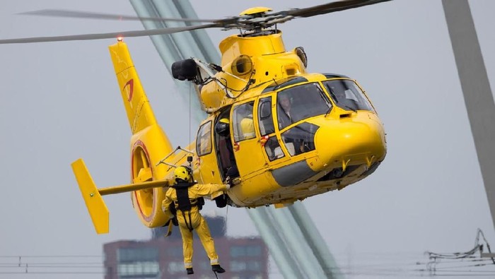 ROTTERDAM, NETHERLANDS - SEP 3, 2016: Eurocopter AS365 Daupin rescue helicopter from NHV-Noordzee Helikopters in action.