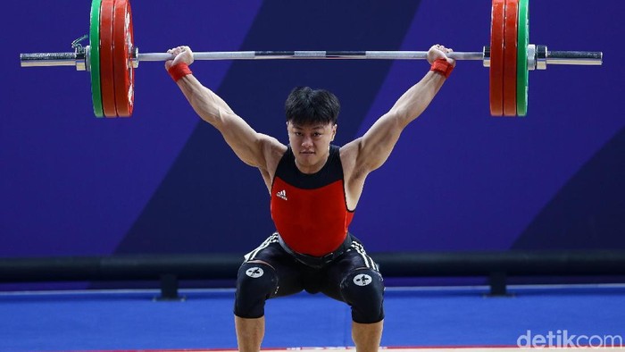 Atlet angkat besi, Rahmat Erwin Abdullah, menambah koleksi medali emas Indonesia di SEA Games 2019 Filipina. Dia menjadi yang terbaik di kelas 73 kg putra.