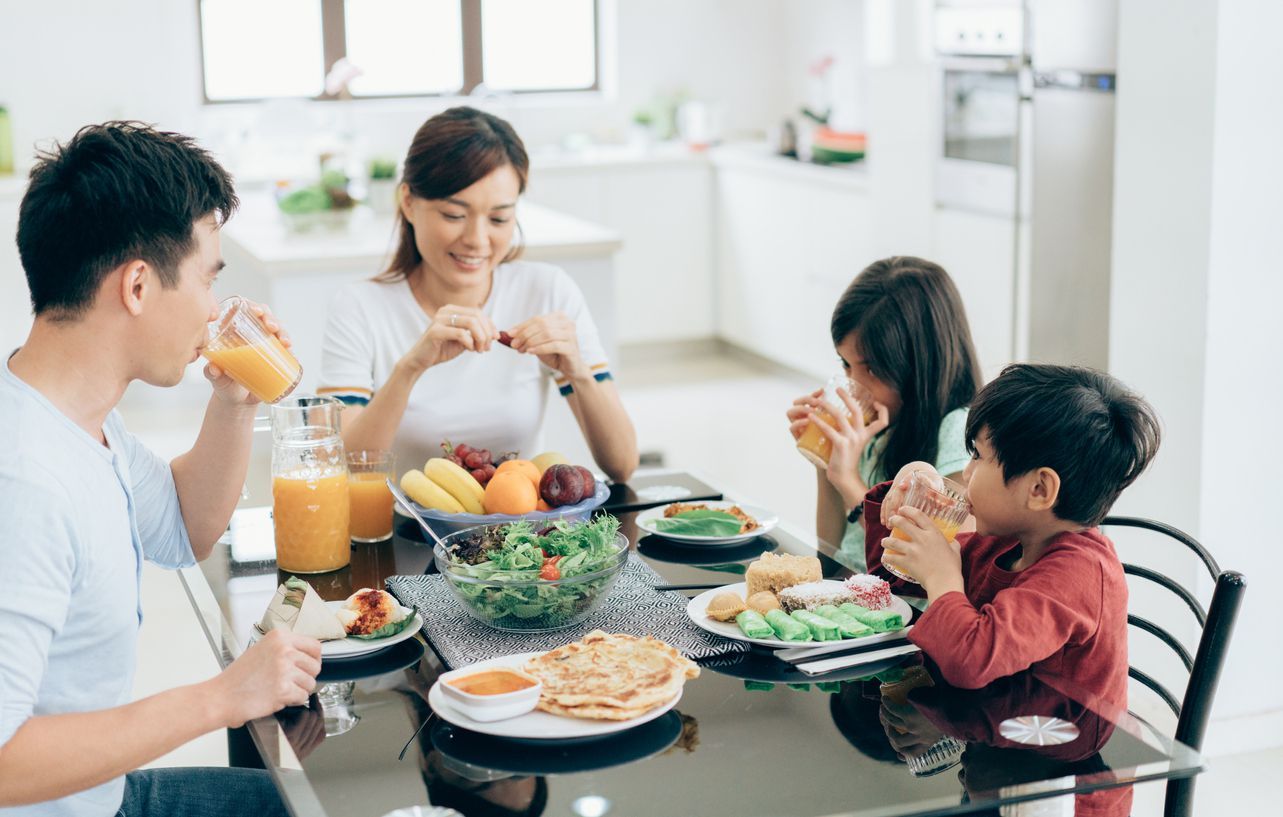happy family eating fresh fruit
