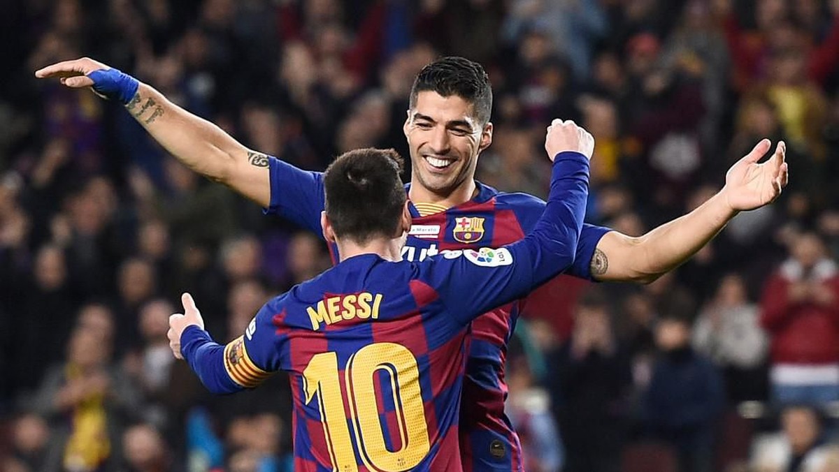 Luis Suarez dan Lionel Messi. (Foto: Photo by Josep LAGO / AFP)