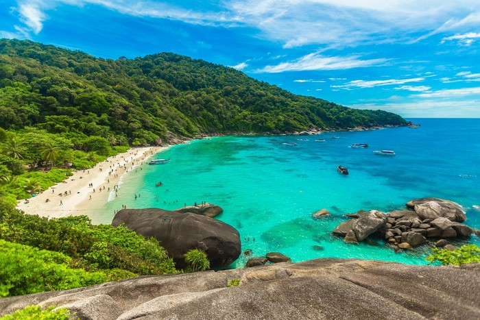 Romantic scene of young love couple take a photo with relaxing and happiness on the beach in Similan islands in Andaman sea at phang nga near Krabi and Phuket in southern of Thailand.