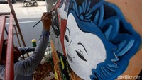 Pengerjaan mural tersebut ditargetkan dapat rampung pada bulan Desember ini.