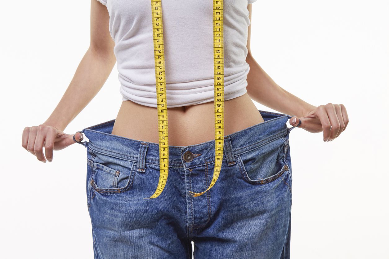 Cute and beauty young woman losing weight.