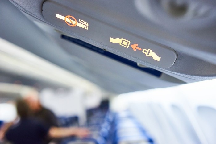 Fasten Seat belt sign  and No Smoking sign on a plane