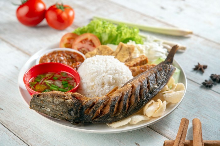 Ikan lele Fried catfish rice with sambal, popular traditional Malay or Indonesian local food.