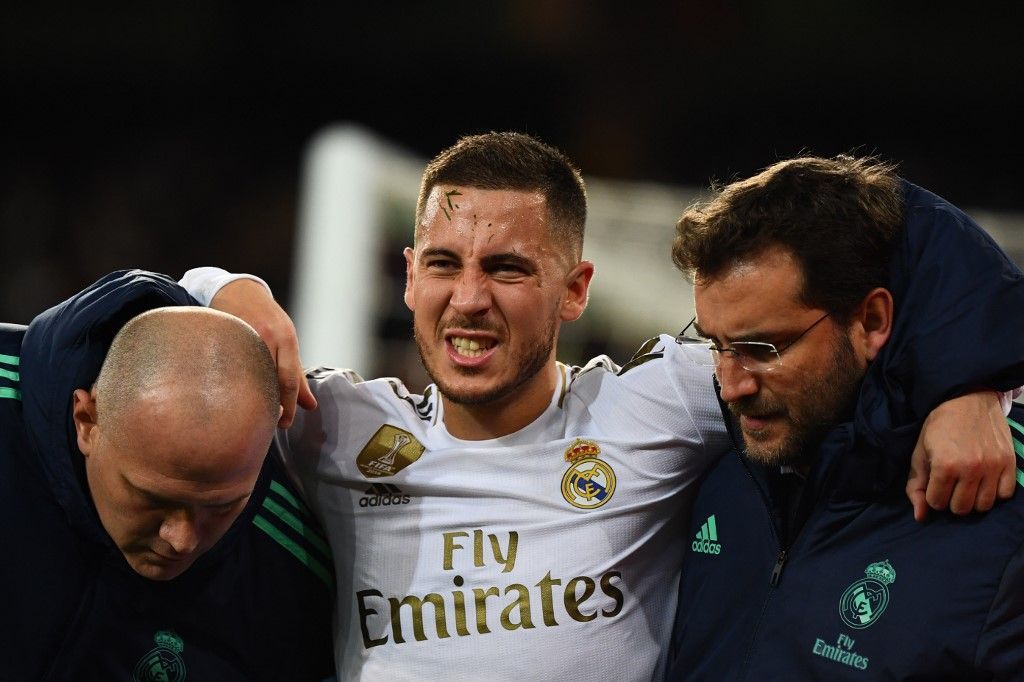 Eden Hazard (FILES) In this file photo taken on November 26, 2019 Real Madrid's Belgian forward Eden Hazard gestures in pain during the UEFA Champions League group A football match Real Madrid against Paris Saint-Germain FC at the Santiago Bernabeu stadium in Madrid. - Eden Hazard is set to miss the Clasico against Barcelona after further tests revealed a fracture in his right ankle, Real Madrid confirmed on December 5, 2019. (Photo by GABRIEL BOUYS / AFP)