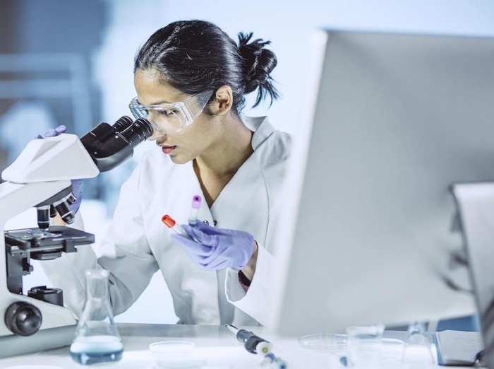 Ilustrasi peneliti di laboratorium Scientist Working in The Laboratory