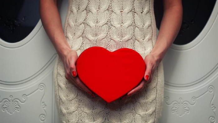 female hand holding object shape heart concept