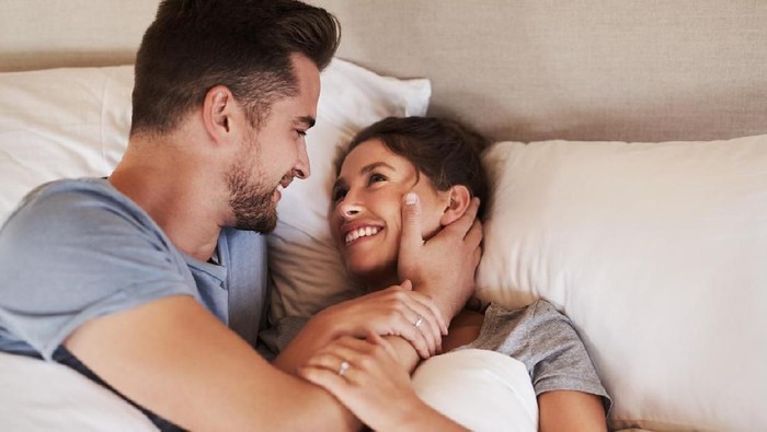 1160779346 Shot of an affectionate young couple spending some quality time together in their bedroom at home