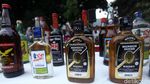 Polda Metro Jaya Gilas Ribuan Botol Miras dengan Alat Berat
