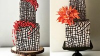 Cake dengan bentuk artistik yang memiliki dominasi warna putih, cokelat dan merah ini terbuah dari bolu yang ditumpuk dan dibentuk menggunakan icing fondant rasa cokelat. Cantik dan terlihat artistik sekali ya. Foto: Instagram @albenacakedesign