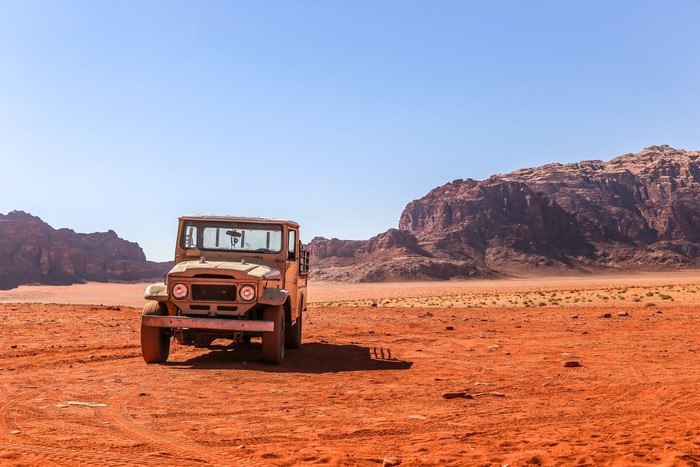 Wadi Rum also known as The Valley of the Moon is a valley cut into the sandstone and granite rock in southern Jordan 60 km (37 mi) to the east of Aqaba; it is the largest wadi in Jordan. The name Rum most likely comes from an Aramaic root meaning high or elevated. The area is now one of Jordans important tourist destinations, and attracts an increasing number of foreign tourists, particularly trekkers and climbers, but also for camel and horse safari or simply day-trippers from Aqaba or Petra.