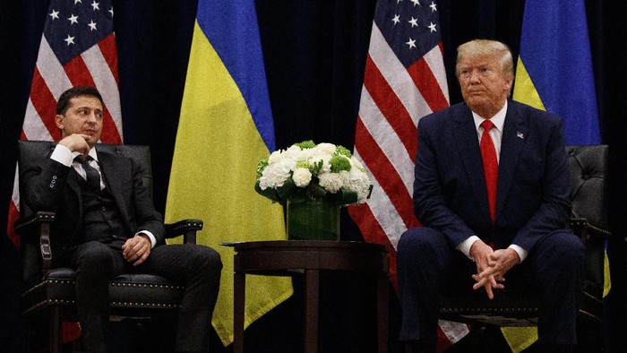 FILE In this file photo taken on Wednesday, Sept. 25, 2019, U.S. President Donald Trump meets with Ukrainian President Volodymyr Zelenskiy at the InterContinental Barclay New York hotel during the United Nations General Assembly, in New York. Ukraines president sits down Monday, Dec. 9, 2019 for peace talks in Paris with Russian President Vladimir Putin in their first face-to-face meeting, and the stakes could not be higher. More than five years of fighting in eastern Ukraine between government troops and Moscow-backed separatists has killed more than 14,000 people, and a cease-fire has remained elusive. (AP Photo/Evan Vucci, File)