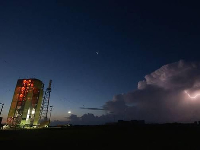 Lightning strikes at dawn near NASAs Orion test vehicle during a rollout on Jun 28, 2019. (Photo: US Space Force website)