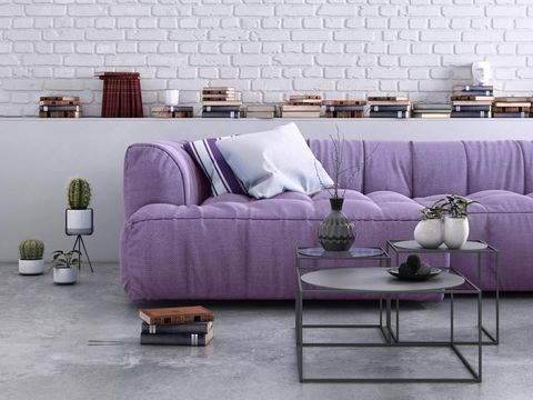 Home apartment interior, living room with large sofa, lots of decor and elements, plant, vase, coffee table, carpet, pastel colors with many elements around. lots of pillows, modern contemporary hipster style interior. copy space wall for designers