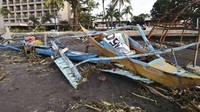 Topan Phanfone menyapu desa-desa terpencil dan daerah wisata populer di Filipina tengah pada hari Natal. Kejadian itu menyebabkan 16 orang tewas. AP Photo.