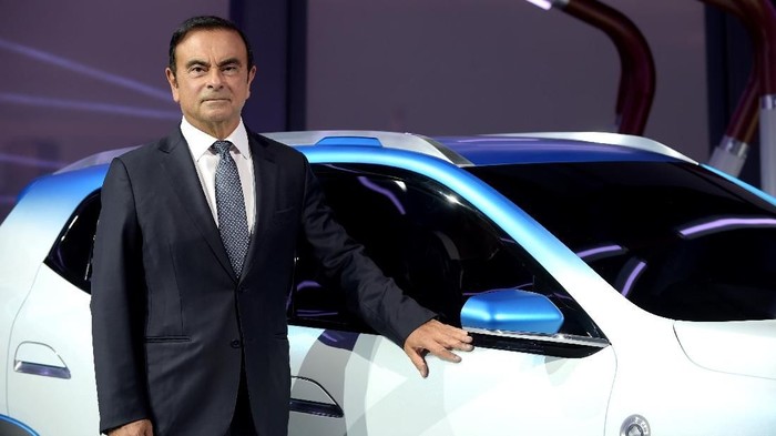 (FILES) In this file photo taken on October 01, 2018 then Chairman and CEO of Renault-Nissan-Mitsubishi Carlos Ghosn presents the Renault K-ZE for the Chinese market during a world premiere as part of an Renault electric evening on the eve of the first press day of the Paris Motor Show. - Former Nissan chief Carlos Ghosn, who was on bail in Tokyo awaiting trial on financial misconduct charges, has arrived in Beirut, Lebanese official and security sources said on December 30, 2019. (Photo by ERIC PIERMONT / AFP)