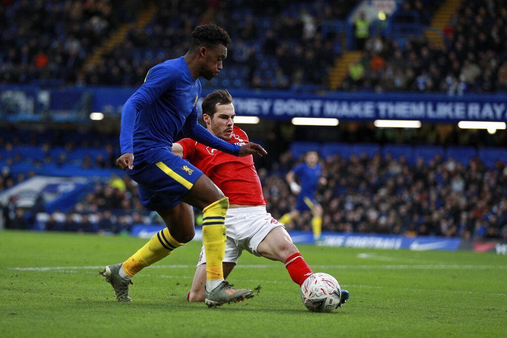 Chelsea vs Nottingham Forest Nottingham Forest's Yuri Ribeiro tries to tackle Chelsea's Callum Hudson-Odoi, left, during an English FA Cup third round soccer match between Chelsea and Nottingham Forest at Stamford Bridge in London, Sunday, Jan. 5, 2020. (AP Photo/Ian Walton)