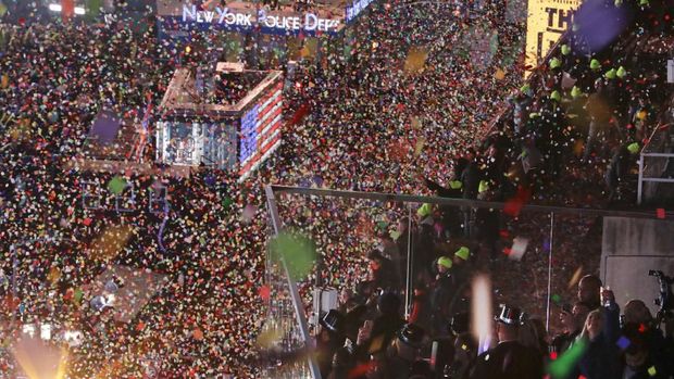 Confetti drops over the crowd after the clock struck midnight during the New Year's celebration as seen from the New York Marriott Marquis in New York's Times Square, early Wednesday, Jan. 1, 2020. (AP Photo/Frank Franklin II)