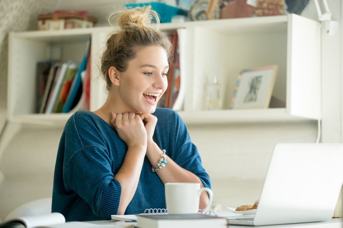 Young Asian beautiful woman using smart phone for business, online shopping, transfer money, financial, internet banking. in coffee shop cafe over blurred background.