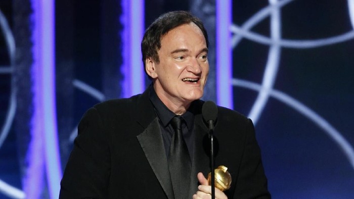 Quentin Tarantino BEVERLY HILLS, CALIFORNIA - JANUARY 05: In this handout photo provided by NBCUniversal Media, LLC,  Quentin Tarantino accepts the award for BEST SCREENPLAY - MOTION PICTURE for Once Upon a Time...in Hollywood onstage during the 77th Annual Golden Globe Awards at The Beverly Hilton Hotel on January 5, 2020 in Beverly Hills, California. (Photo by Paul Drinkwater/NBCUniversal Media, LLC via Getty Images)
