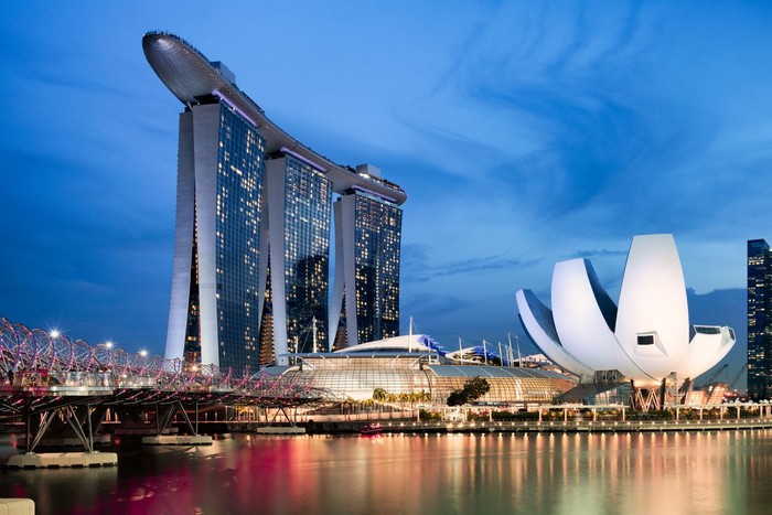Singapore, Singapore - April 24, 2018: Singapore skyline view during sunset. In the picture the Marina Bay Sands hotek, the Helix Bridge and the ArtScience Museum