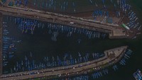 Foto udara sejumlah kapal nelayan bersandar di Pelabuhan Perikanan Cikidang, Kabupaten Pangandaran, Jawa Barat, Rabu (8/1/2020).