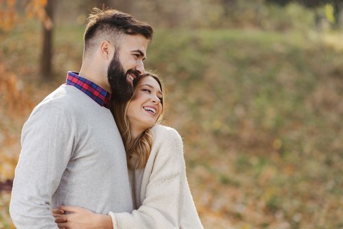 Young couple  lying in the bed early in the morning in bedroom