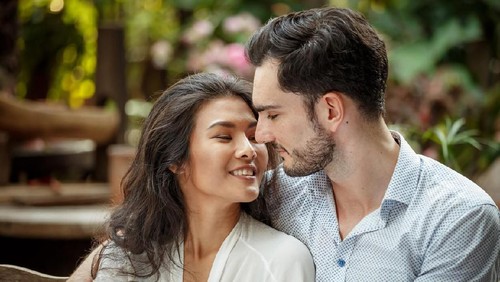 Young couple  lying in the bed early in the morning in bedroom